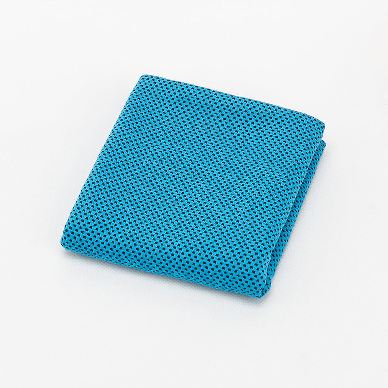 Sky blue cooling towel folded on white background